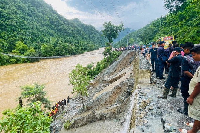 Nepal recovers first body from buses swept away by landslide